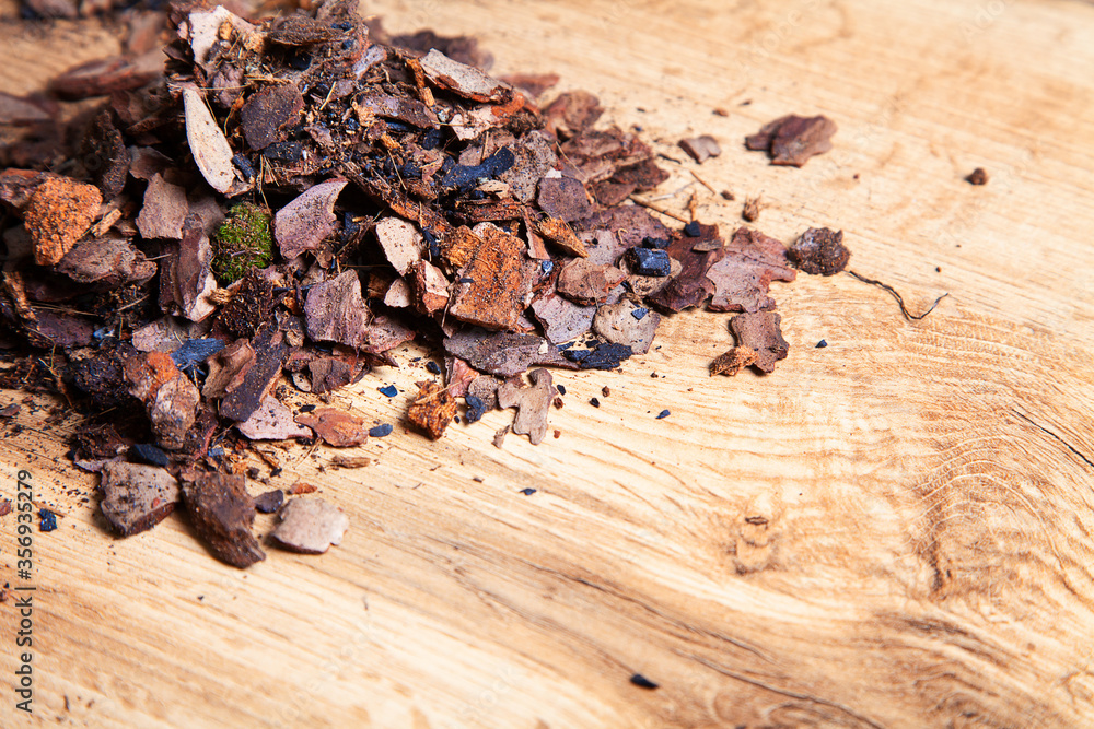 Dry pine bark for transplanting orchids of other plants. The substrate