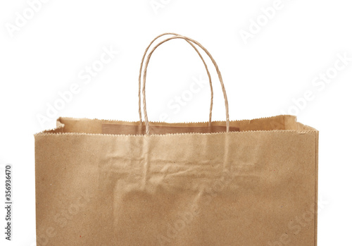 empty disposable brown craft paper bag with handles