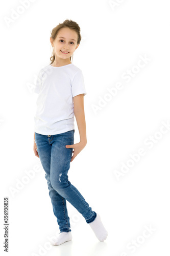 Pretty Stylish Girl with Ponytail Standing with Hands on Her Waist.