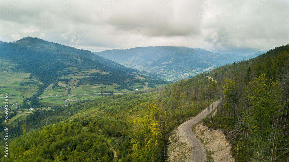 Naklejka premium mountain road in the mountains,Carpathian mountains in the clouds
