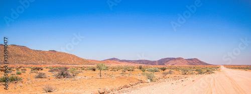 Fototapeta Naklejka Na Ścianę i Meble -  A gravel road in Namibia, Africa