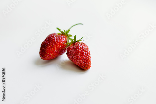  Red strawberries on a white background. Natural eco-product.