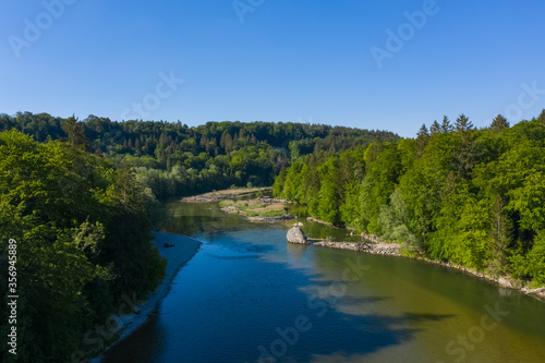 Bird view of Isar river near Baierbrunn with forest around. Typical alpine landscape.