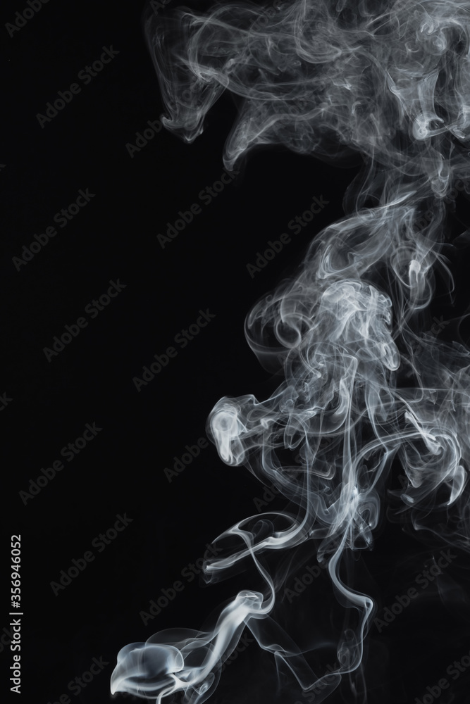 Smooth movement of abstract smoke on dark background. Beautiful white smoke on black background. Selective focus Smooth movement of abstract smoke on dark background. Beautiful white smoke on black background. Selective focus