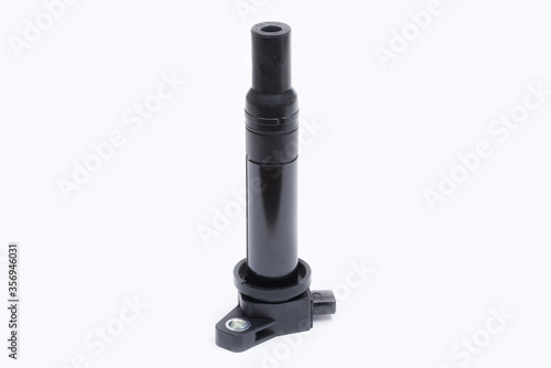 New car engine individual ignition coil on white background close up