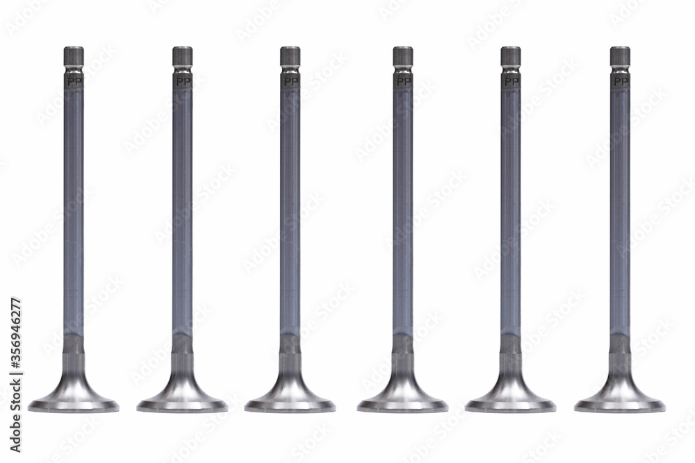 Six of intake engine valves isolated on white background. photo of the Valve of the engine metal on a white background Six of intake engine valves isolated on white background. photo of the Valve of the engine metal on a white background