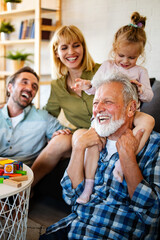 Senior grandparents playing with grandchildren and having fun with family