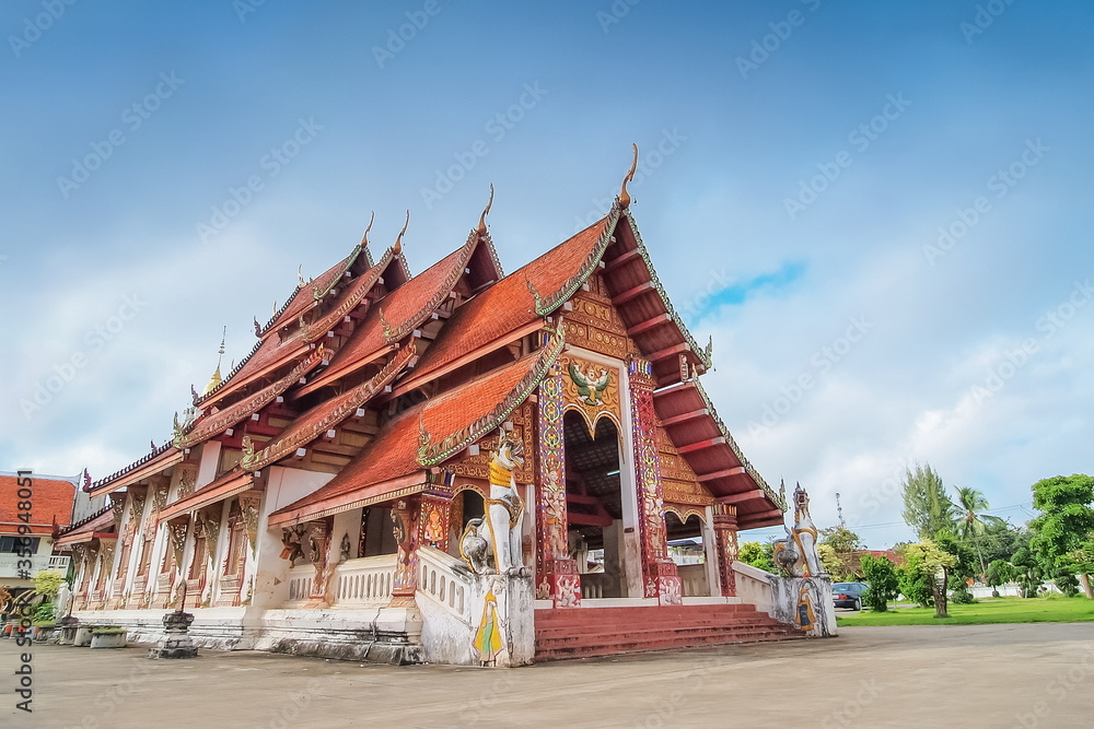 view of buddhist temple with blue sky background, Wat Wiang Sa, Nan Province, northern of Thailand.
