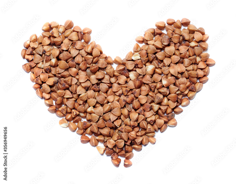 Raw buckwheat grain, heart shape. Raw buckwheat grain, heart shape.