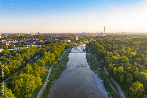 Aerial view photograph of Isar river flowing into the south german city of Munich. Munich centre behind river from above bird view