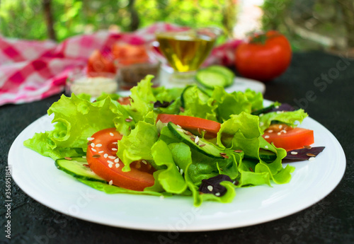  Salad of fresh vegetables and herbs. Close-up.