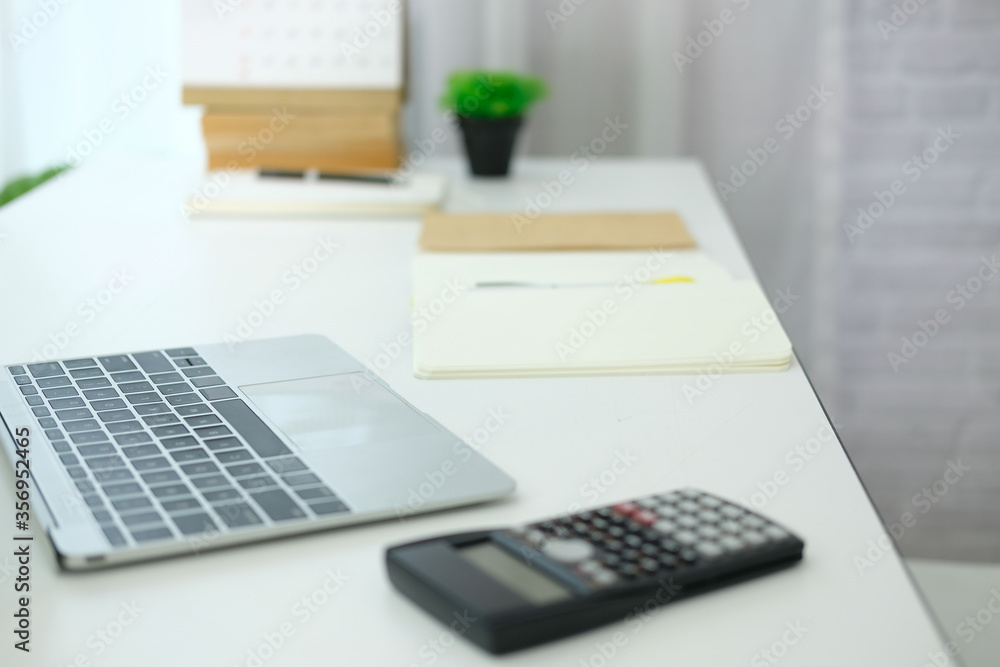 computer laptop calculator notebook on office desk. computer laptop calculator notebook on office desk.