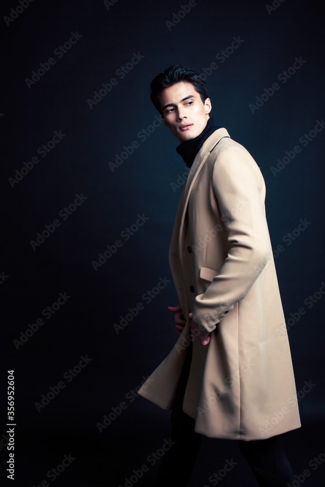 handsome asian fashion looking man posing in studio on black background, lifestyle modern people concept handsome asian fashion looking man posing in studio on black background, lifestyle modern people concept