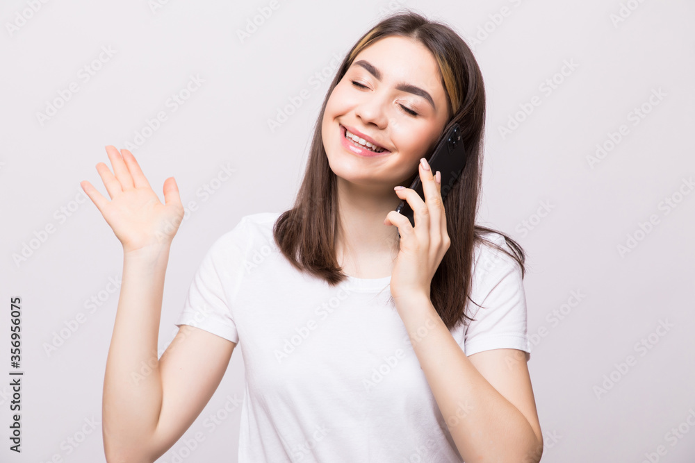 Teen girl using cell phone isolated on white background Teen girl using cell phone isolated on white background