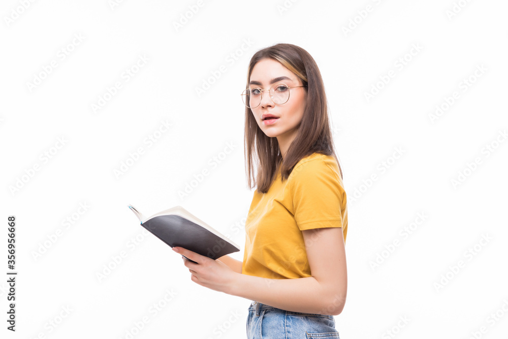 Photo of woman holding diary in hands having creative idea noticing at on paper isolated on white background Photo of woman holding diary in hands having creative idea noticing at on paper isolated on white background