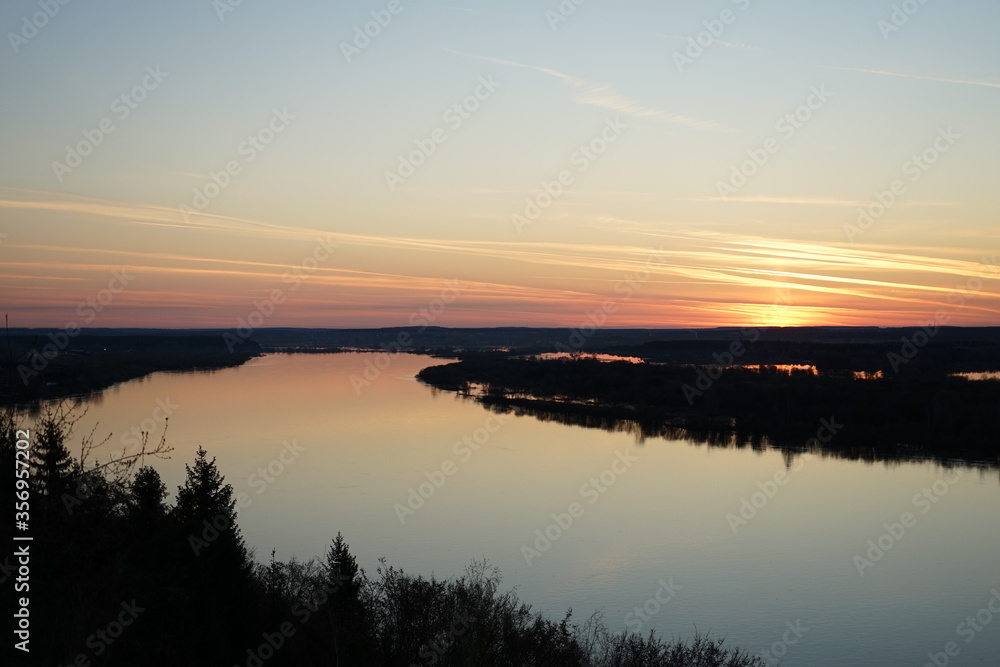 Obraz premium sunset over the river