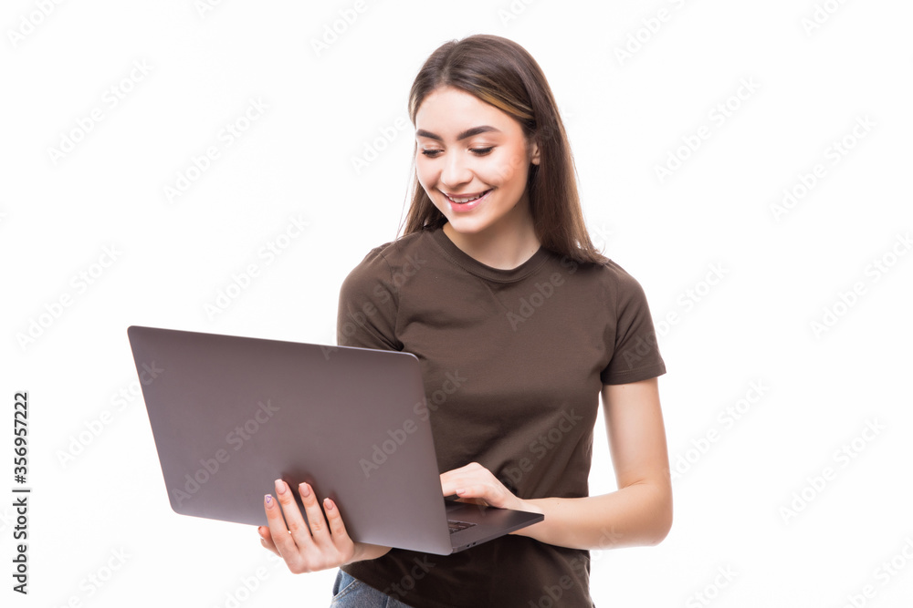 Young woman working on laptop isolated on white background Young woman working on laptop isolated on white background