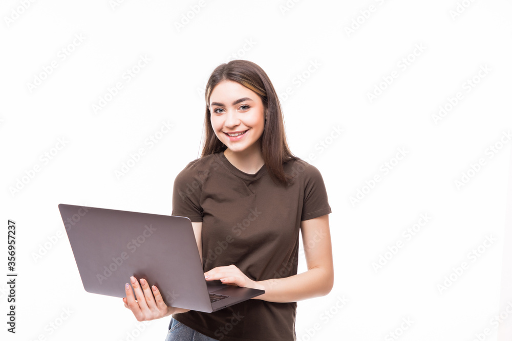 Young woman working on laptop isolated on white background Young woman working on laptop isolated on white background