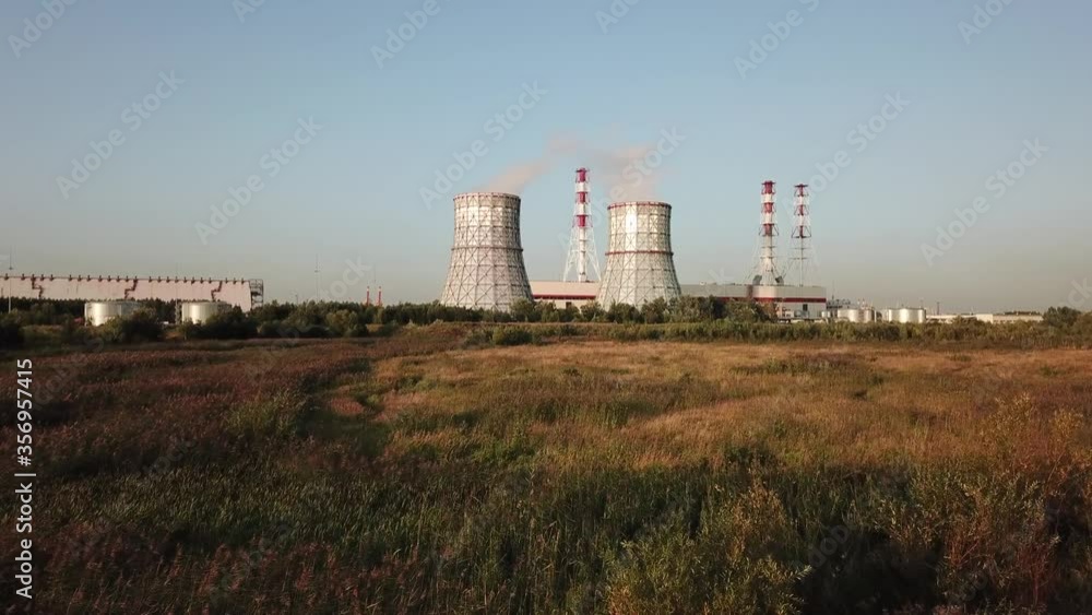 4K summer afternoon aerial drone video of South-Western thermal power station, electricity producing plant, huge cooling water towers, located on outskirts of St.-Petersburg, Leningrad Region, Russia 4K summer afternoon aerial drone video of South-Western thermal power station, electricity producing plant, huge cooling water towers, located on outskirts of St.-Petersburg, Leningrad Region, Russia