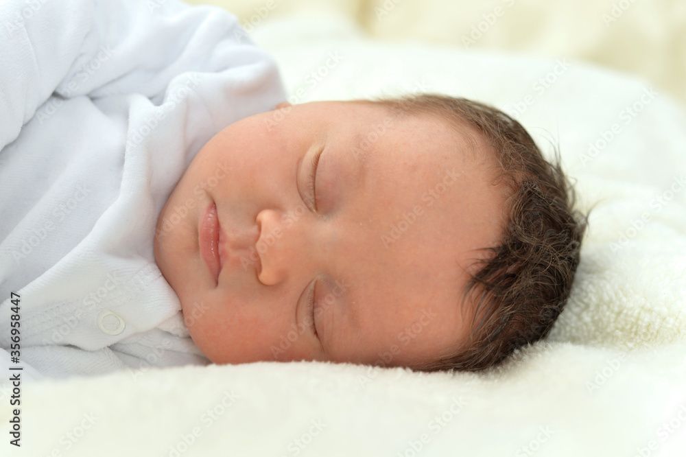 Cute little baby boy on bed sleeping Cute little baby boy on bed sleeping