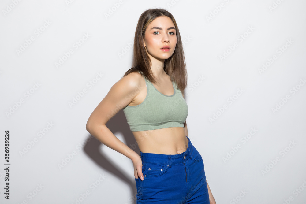 Young casual pretty woman isolated over white background. Young casual pretty woman isolated over white background.