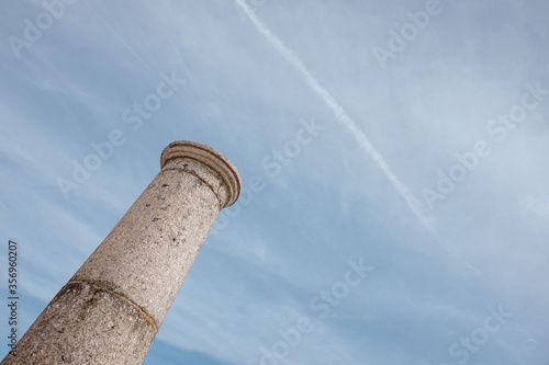 Stone tower, sky with chemtrails