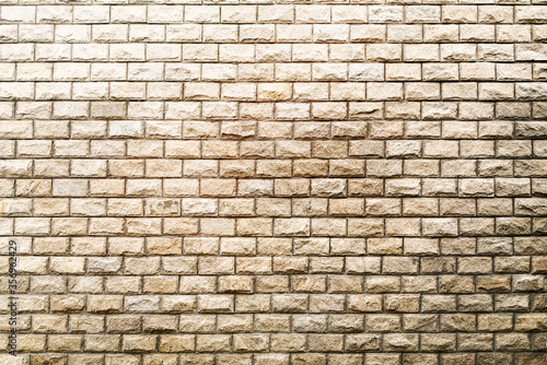 Rough stone brick wall texture background.