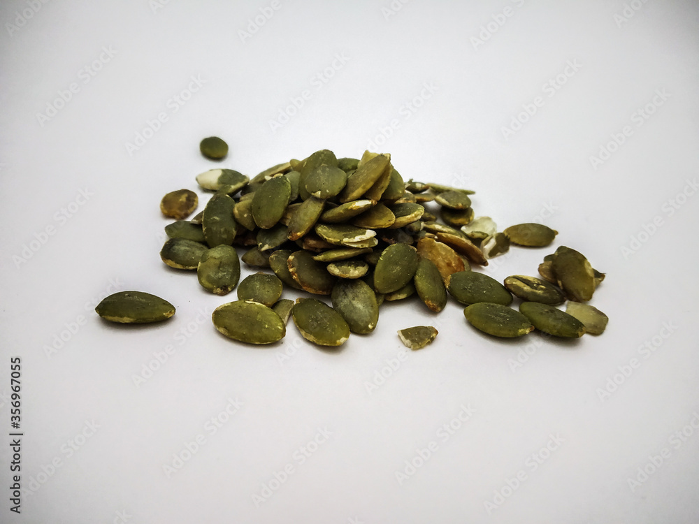 pumpkin seed close up shot in a white background