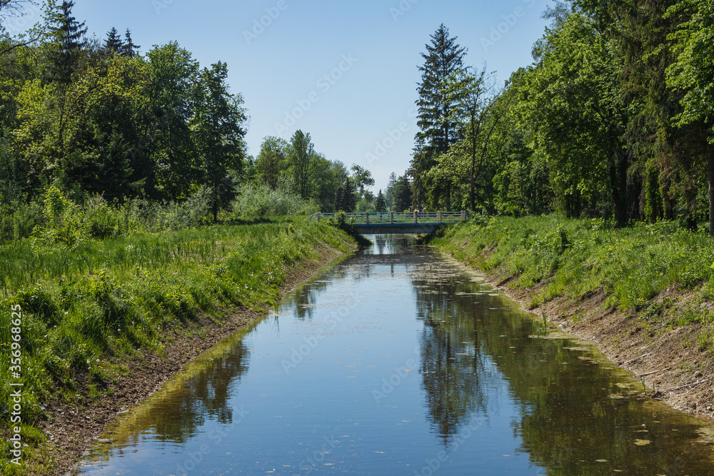 Canal in a city park. Spring landscape