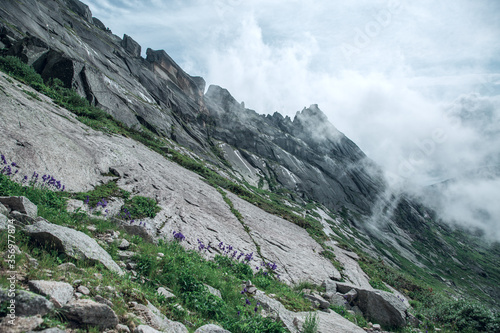 Mountain of nature reserve in Russia covered with fog 