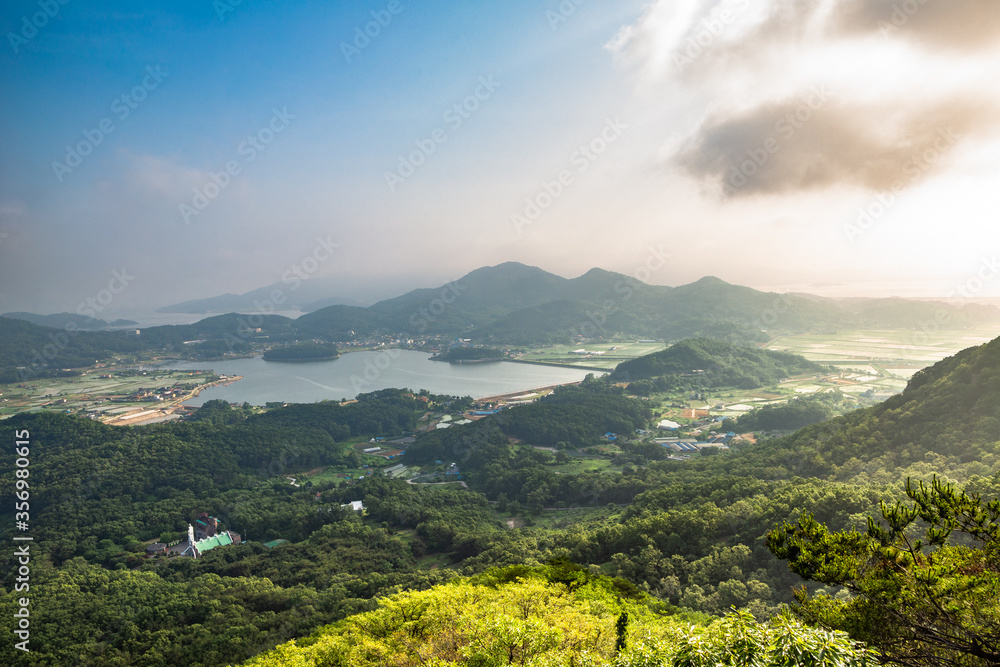 Fototapeta premium View of Ganghwado Island mountains from Goryeosan mountain Jeokseoksa temple in Incheon, Korea