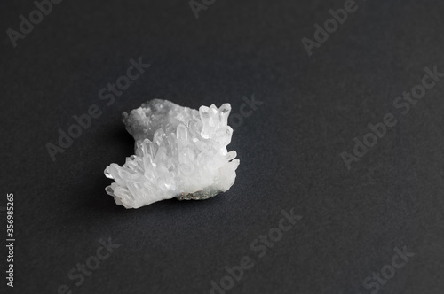 druse - quartz crystals. on black background