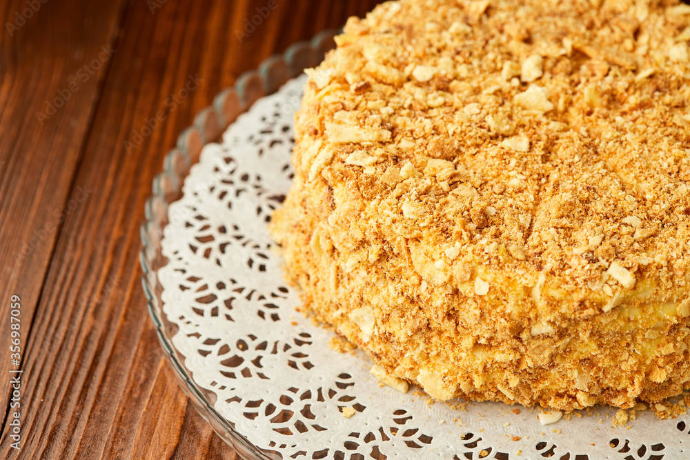 Traditional fresh dessert Napoleon cake on wooden background Traditional fresh dessert Napoleon cake on wooden background