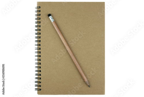 Pencil on top of book on the white background