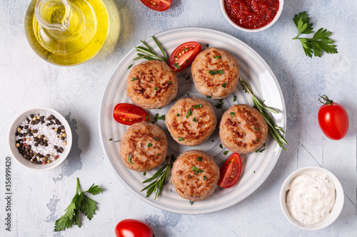 Fresh chicken cutlets with tomatoes and rosemary