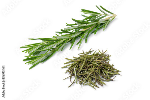 Heap of dried rosemary and fresh rosemary twig