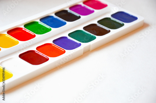 watercolors. bright colors on a white background. accessories for artists, creativity.