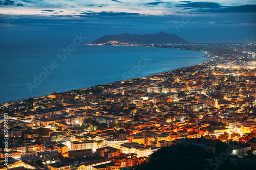 Terracina, Italy. Top View Skyline Cityscape City In Night Illuminations