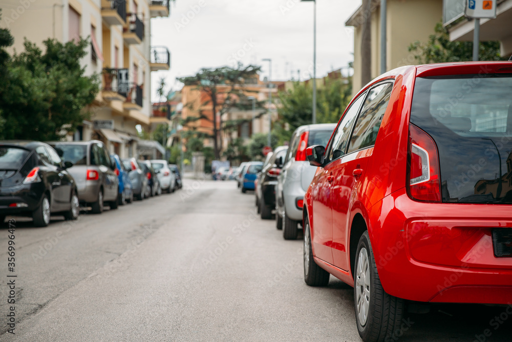 Cars Parked On Street In European City In Summer Day Cars Parked On Street In European City In Summer Day