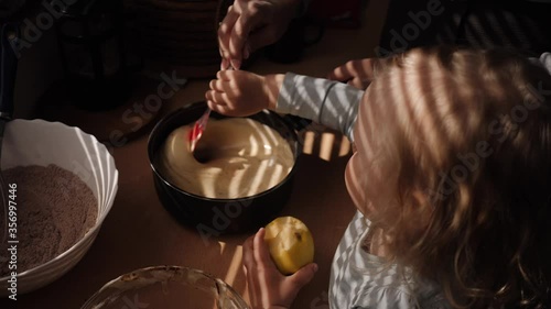 Mother and daughter preparing cookies in the kitchen
