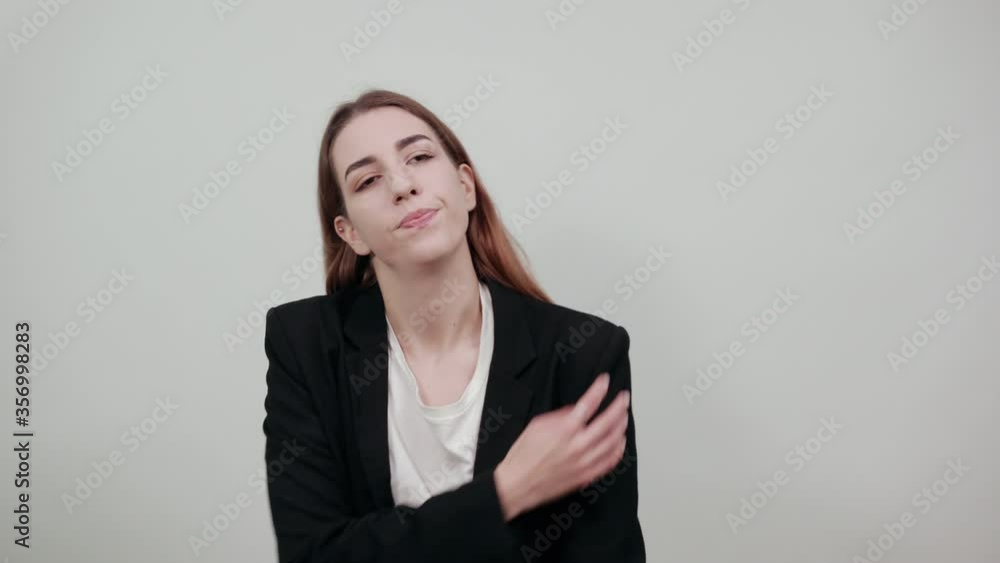 Holds the shoulder hurts, pain in my arm, sore point, problem with health care and exercise. Feel hurt. Terrible ache in spine. Exercises for back. young attractive woman with brown hair Holds the shoulder hurts, pain in my arm, sore point, problem with health care and exercise. Feel hurt. Terrible ache in spine. Exercises for back. young attractive woman with brown hair
