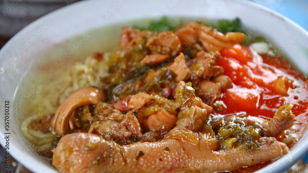 Indonesian food, mie ayam, noodles with chicken presented directly by the seller on the cart Indonesian food, mie ayam, noodles with chicken presented directly by the seller on the cart