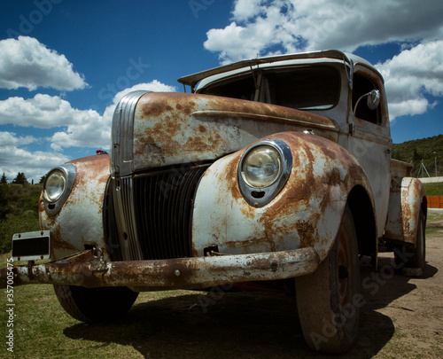 Vintage. Old rusty car. forgotten retro automobile aging in the junkyard