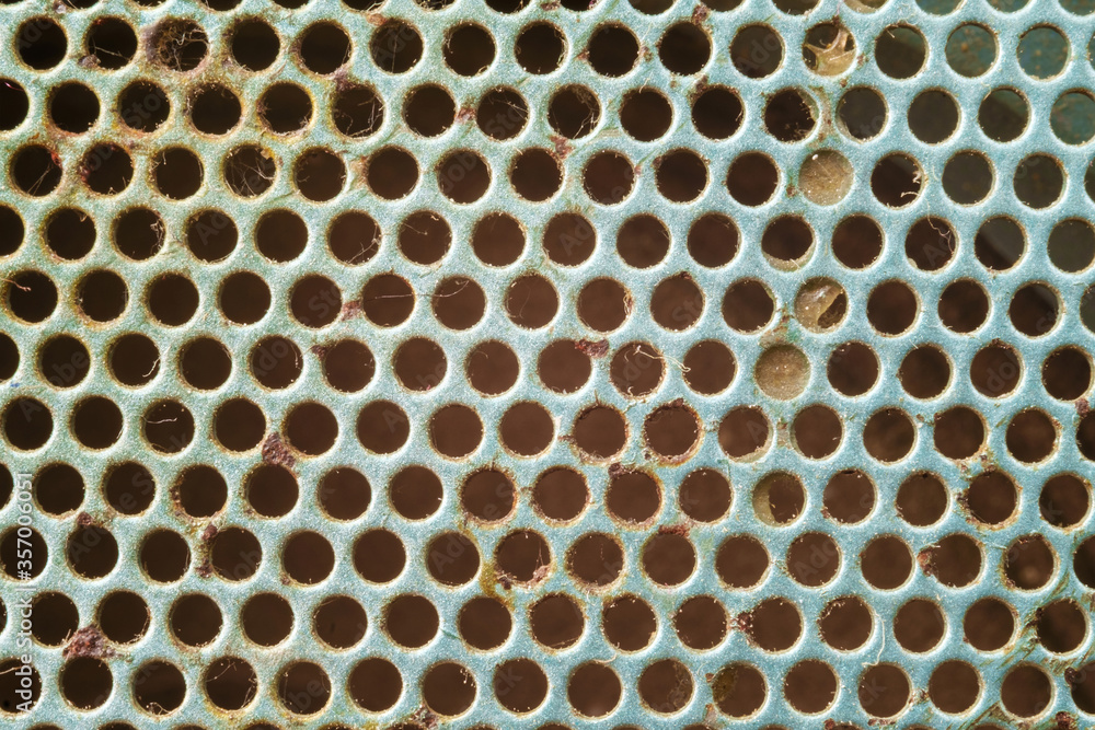 Rusty silver metal background with holes Rusty silver metal background with holes