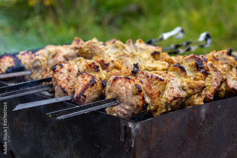 The meat is cooked on skewers in the summer The meat is cooked on skewers in the summer