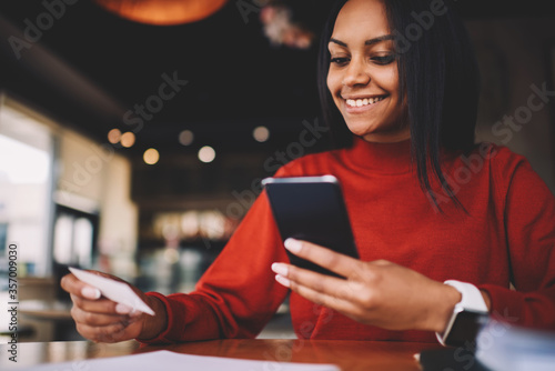 Cheerful afro american student happy getting visit card with phone number of entrepreneur searching job