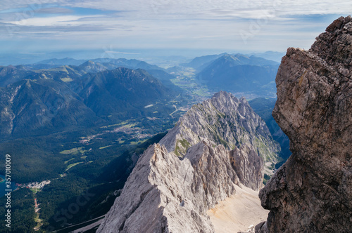 View over the Bavarian alps with a cloudy sky from the top of the Zugspitze mountain