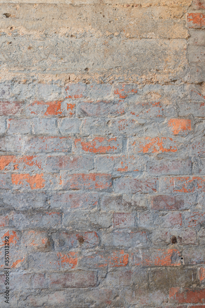 Fototapeta premium Closeup of weathered brick wall texture