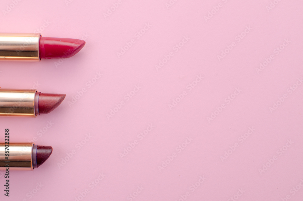 three lipsticks of red and brown tones arranged from longest to shortest three lipsticks of red and brown tones arranged from longest to shortest