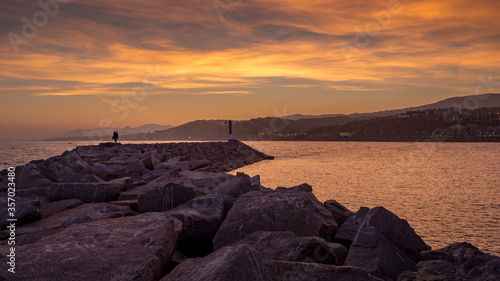 Groyne of Arenys de Mar at sunset photo